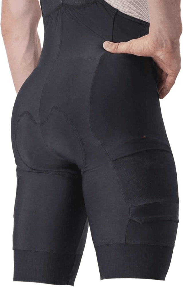 Castelli Unlimited Cargo men's bib knicks displaying their technical fabric, cargo pockets, and ergonomic fit for cycling apparel.