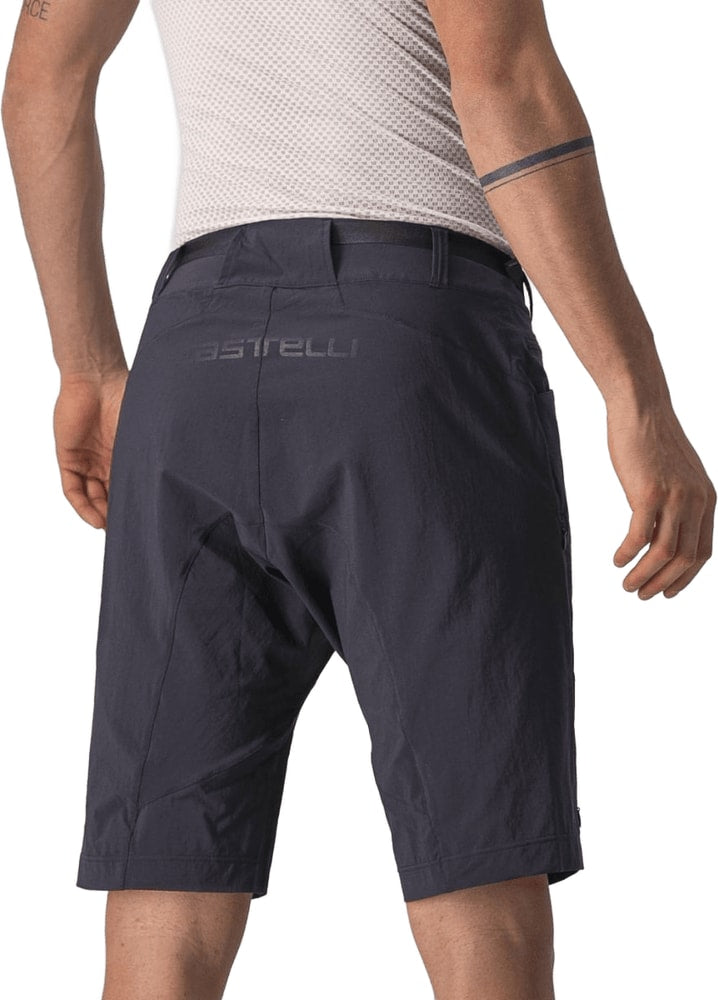 Castelli Unlimited Trail Baggy men's MTB shorts showing durable fabric, relaxed fit, and mountain biking style on a trail-ready rider