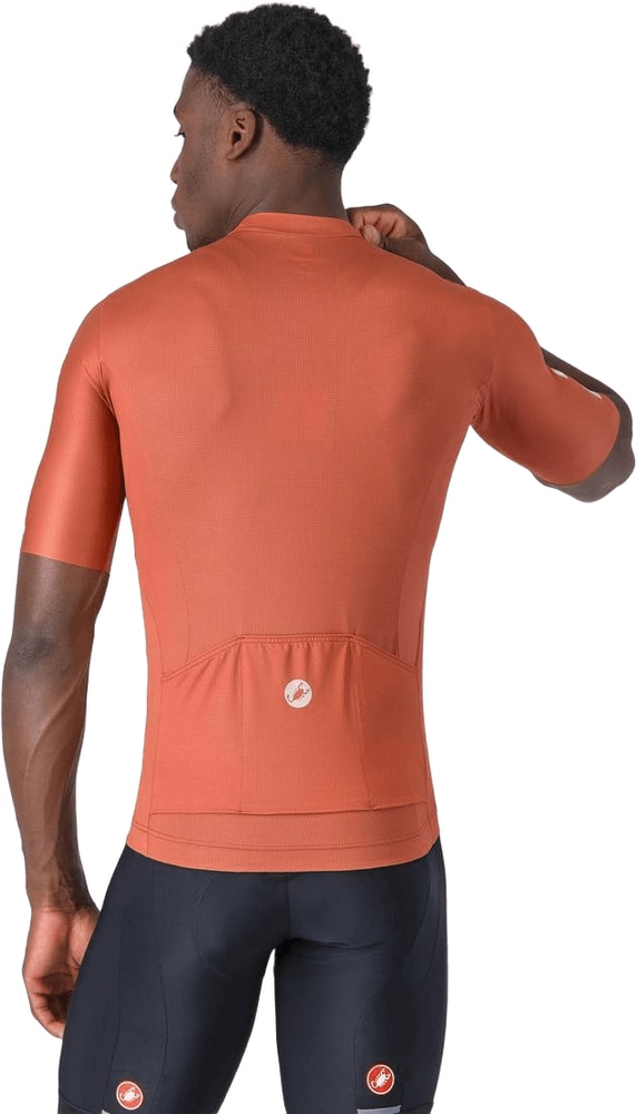 Castelli Entrata Apex SS men's cycling jersey in light blue with short sleeves and logo, worn by a cyclist.