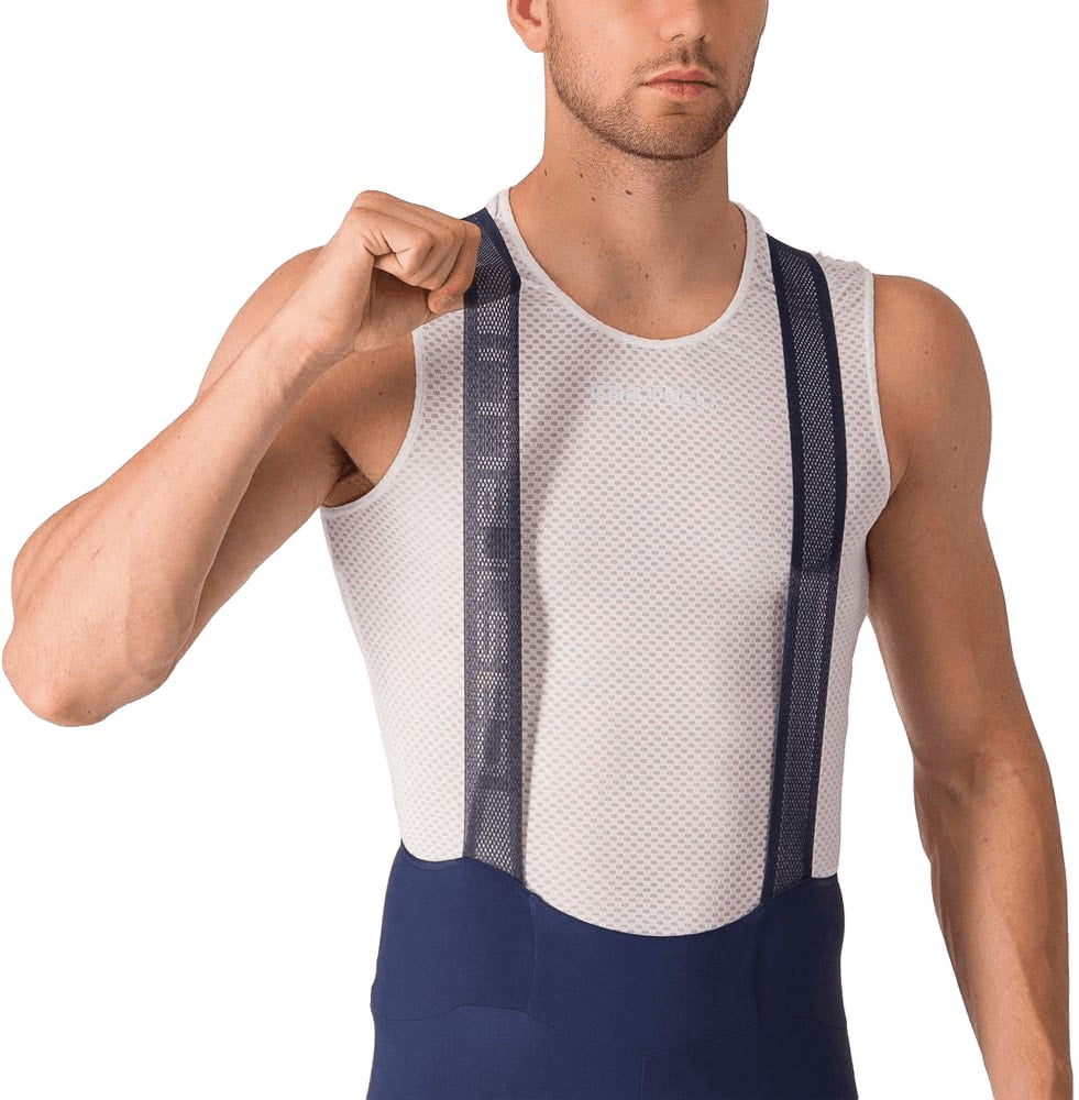 Castelli Espresso men's bib knickers, cycling clothing with padded chamois and breathable fabric, shown on a hanger.