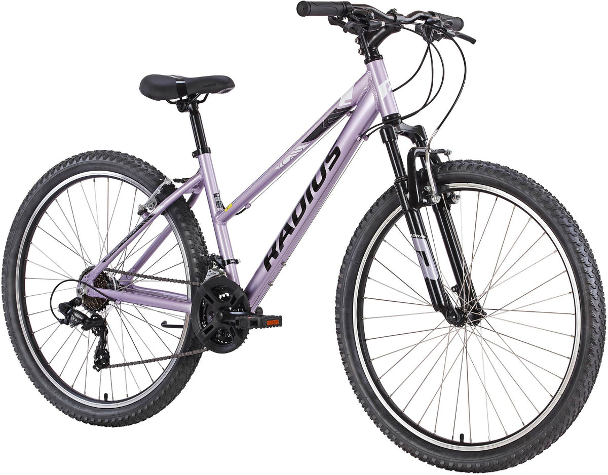 Image of a 2025 Radius Nova 20 hardtail bike with a sleek frame and mountain bike tires, designed for off-road riding.