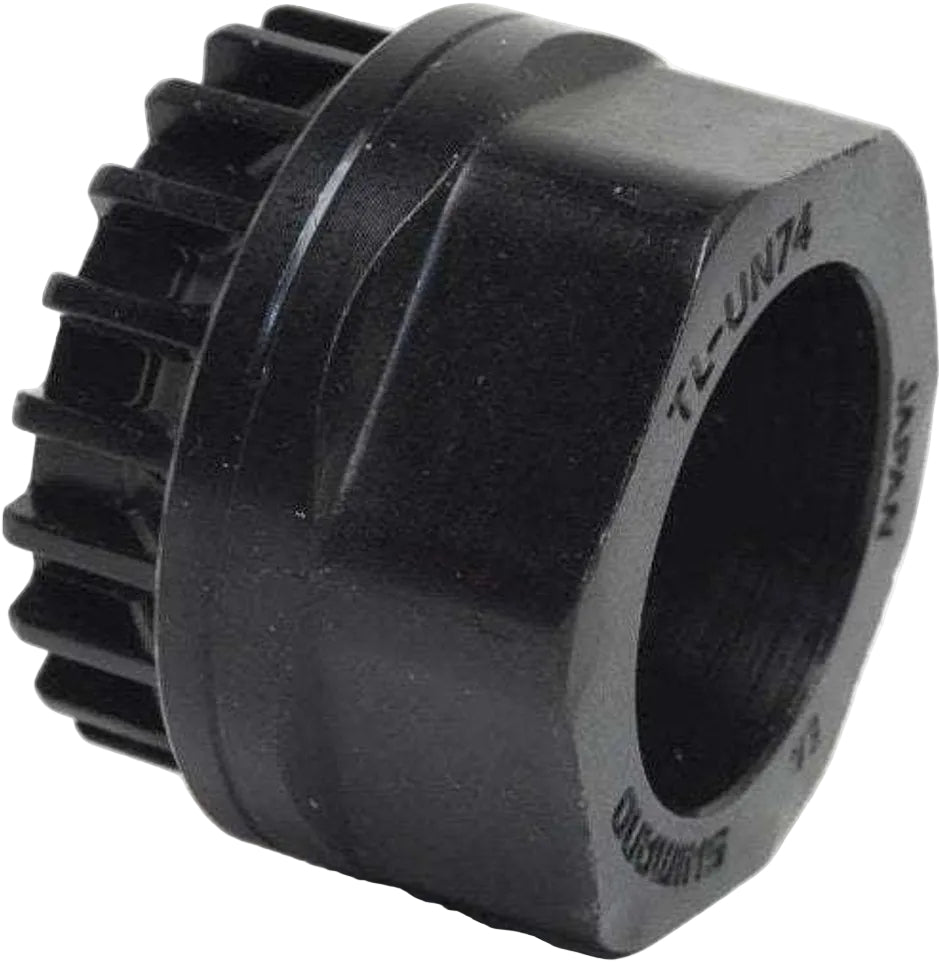 Shimano UN74 bottom bracket tool for bicycle maintenance, shown in close-up with metal construction and ergonomic handle.