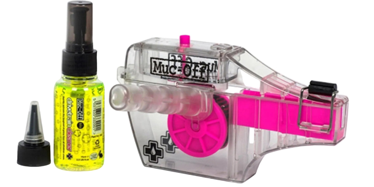 Muc-Off X-3 Dirty Chain Machine for cleaning bicycle chains, shown in a close-up view with its parts visible.