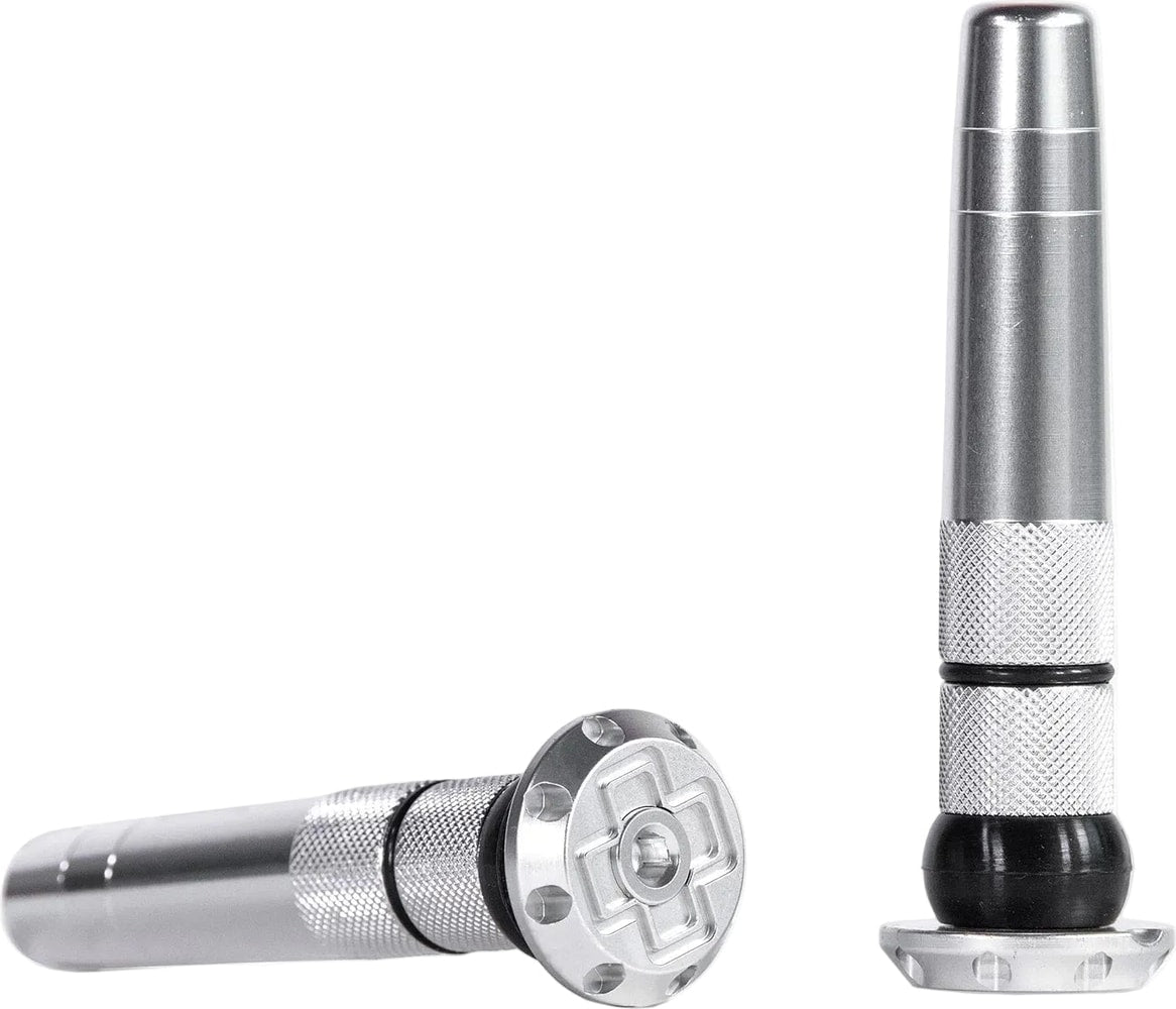 Muc-Off Sealth tubeless plugs for bicycle tires, black plastic accessories for sealing tubeless tire valves and leaks.