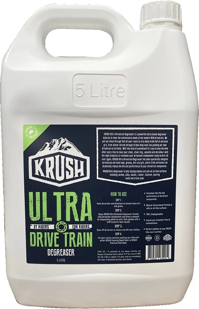 Krush Ultra Drivetrain Degreaser bottle, accessory for bike maintenance, with label and spray nozzle visible.