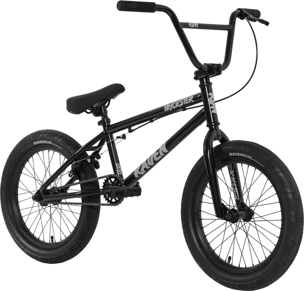 Raven Trickster 18 BMX bike with black frame and colorful graphics, designed for youth riders and stunt riding.
