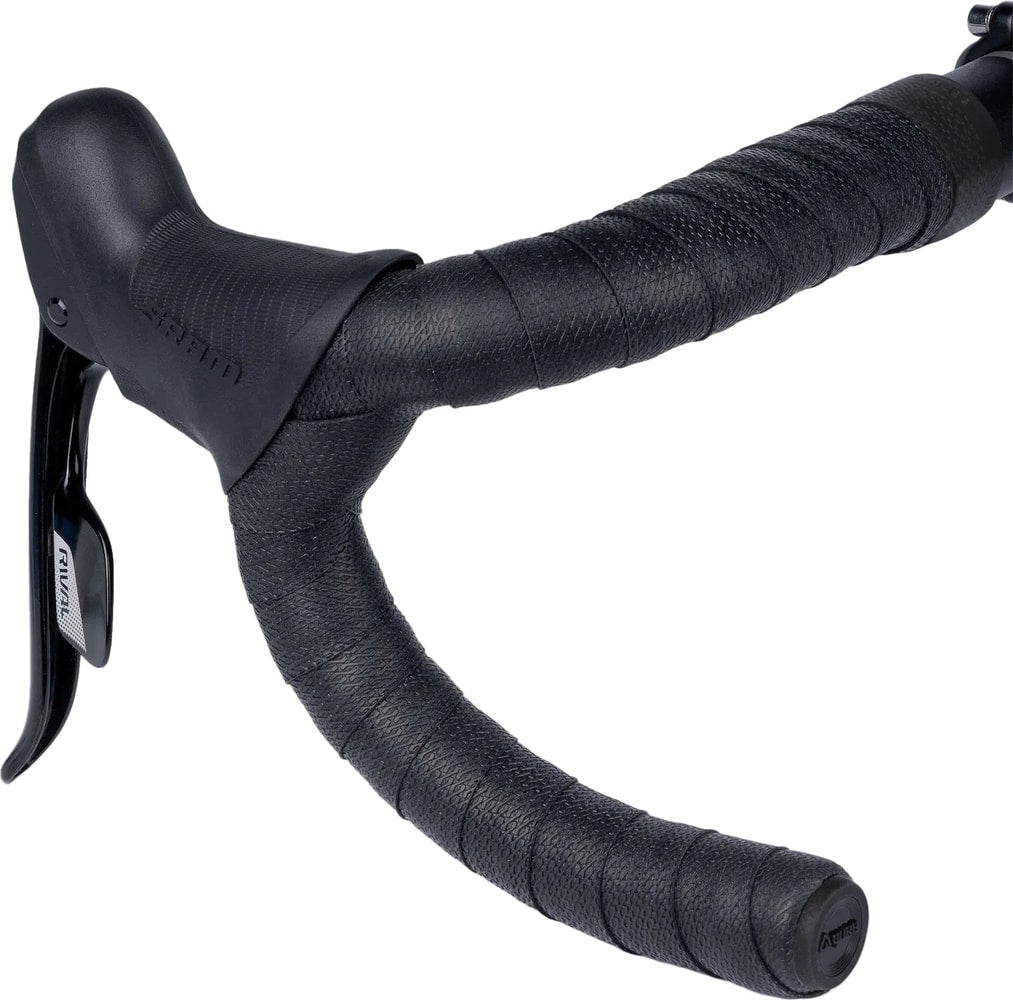 Guee SL One handlebar tape in black, wrapped around a bicycle handlebar, providing grip and comfort for cycling accessories.
