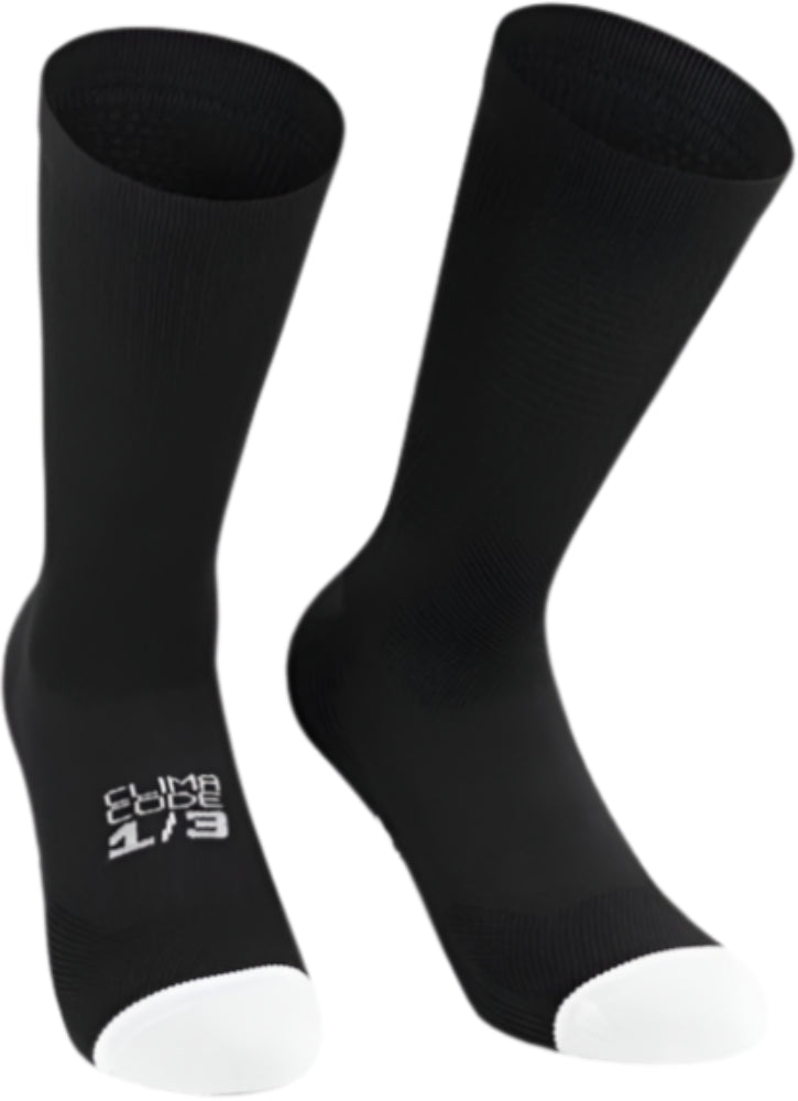 Assos Endurance S11 men's cycling socks in black with red accents, made from breathable, moisture-wicking fabric for performance.