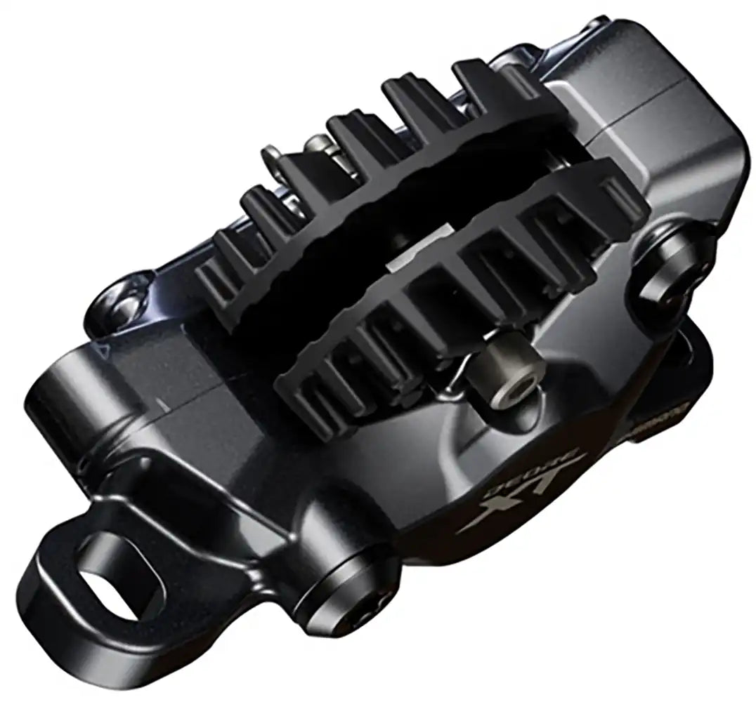Shimano XT XC M8200 hydraulic disc brake caliper for mountain biking, showing the black caliper with mounting bolts.