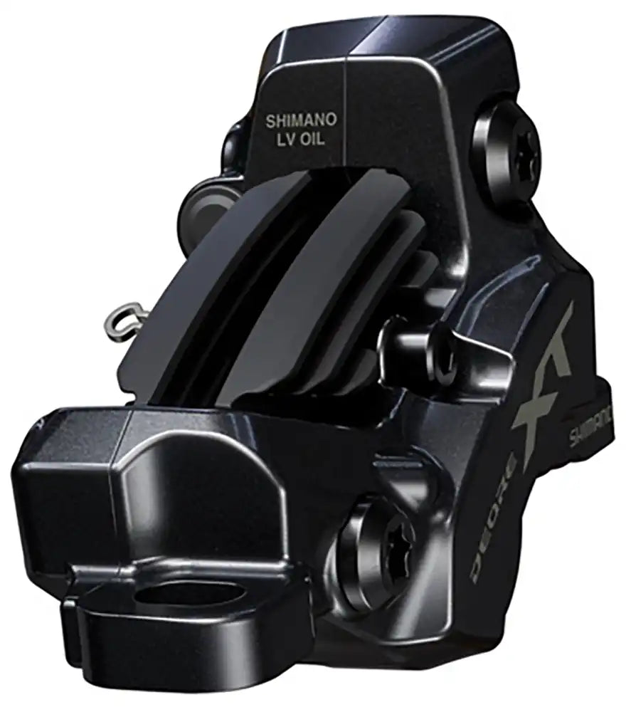 Shimano XT M8220 hydraulic disc brake caliper for enduro bikes, shown in black with mounting hardware and pistons visible.