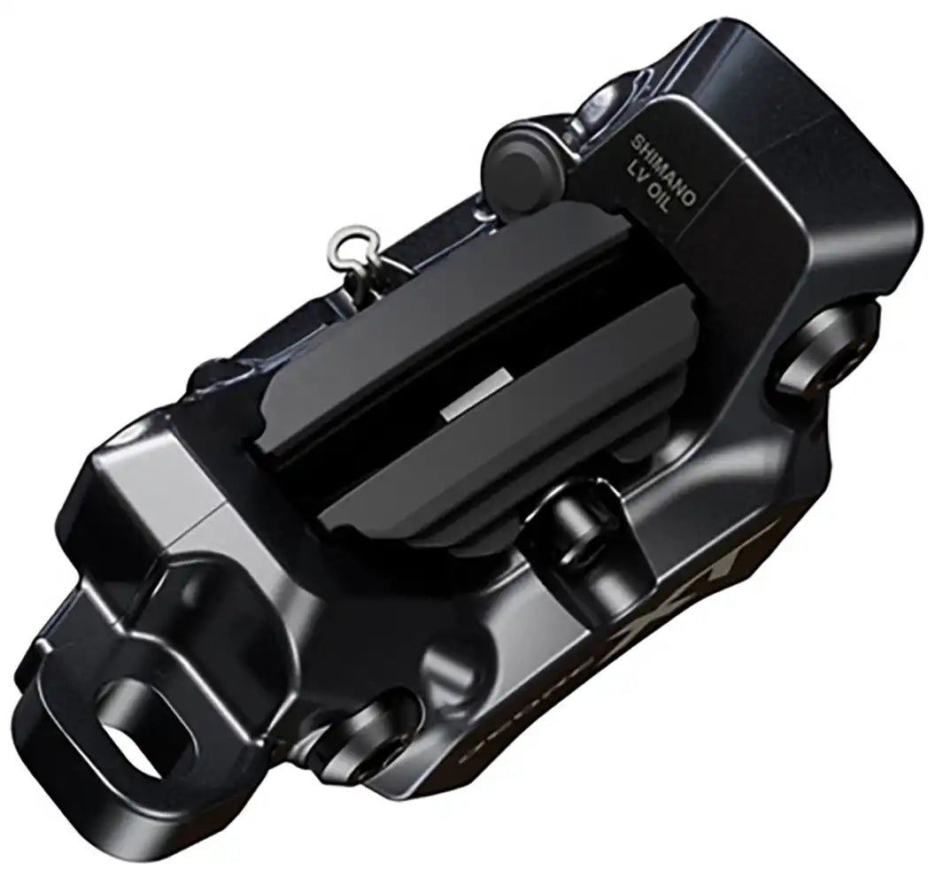Shimano XT M8220 hydraulic disc brake caliper for enduro bikes, showing the black metal body and mounting hardware.