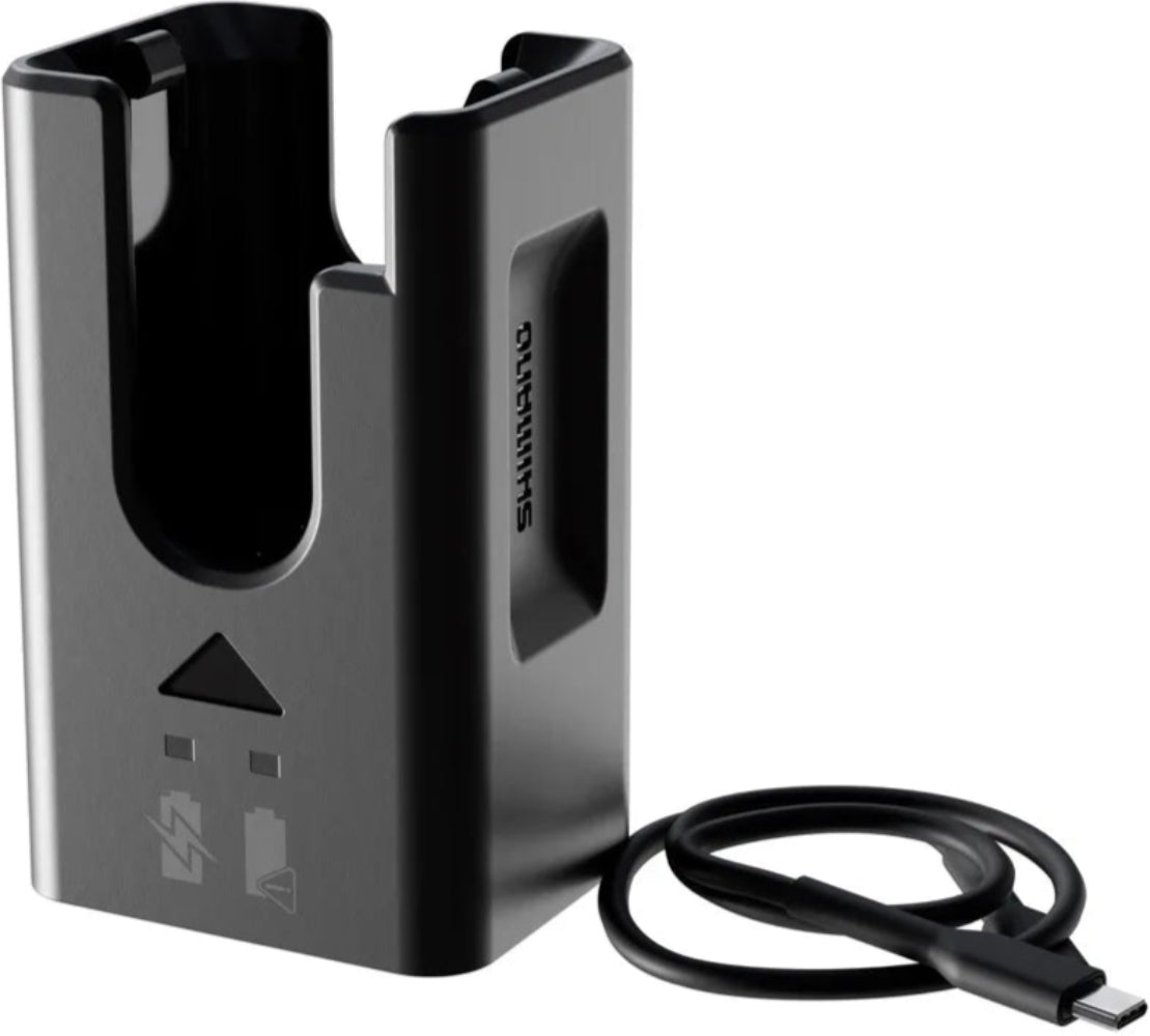 Shimano DN100 battery charger for bike e-bike batteries, showing the electric charger with power cord and connection ports.