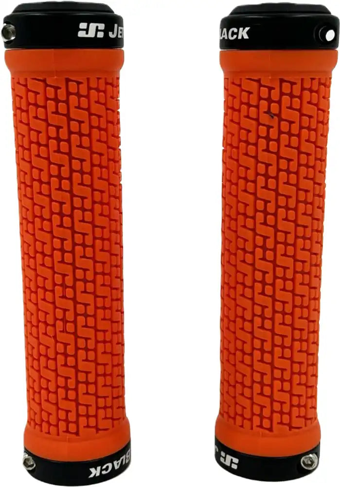 Orange and black Jetblack Pin Lock On grips with rings, designed for bike handlebars, part of Jetblack cycling parts collection.