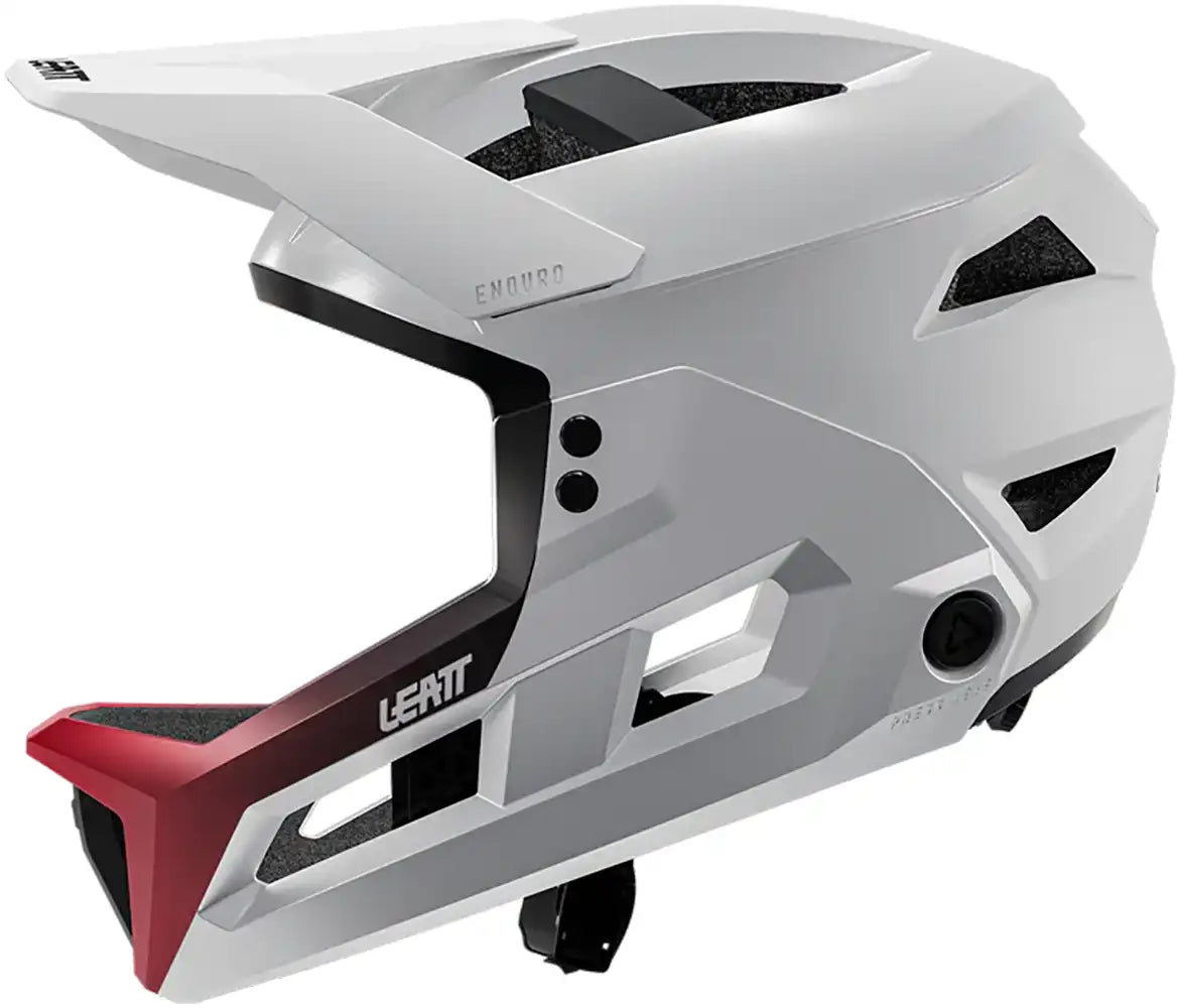 Leatt Enduro 3.0 full face MTB helmet in cream and white, showing side view with ventilation and secure strap details