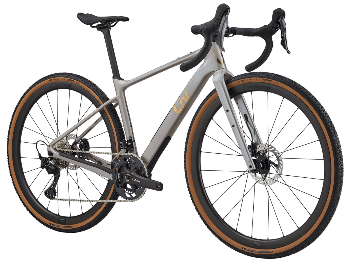 Liv Devote Advanced 0 gravel bike in Camel Silk color, front view showing lightweight frame and rugged design for gravel riding.