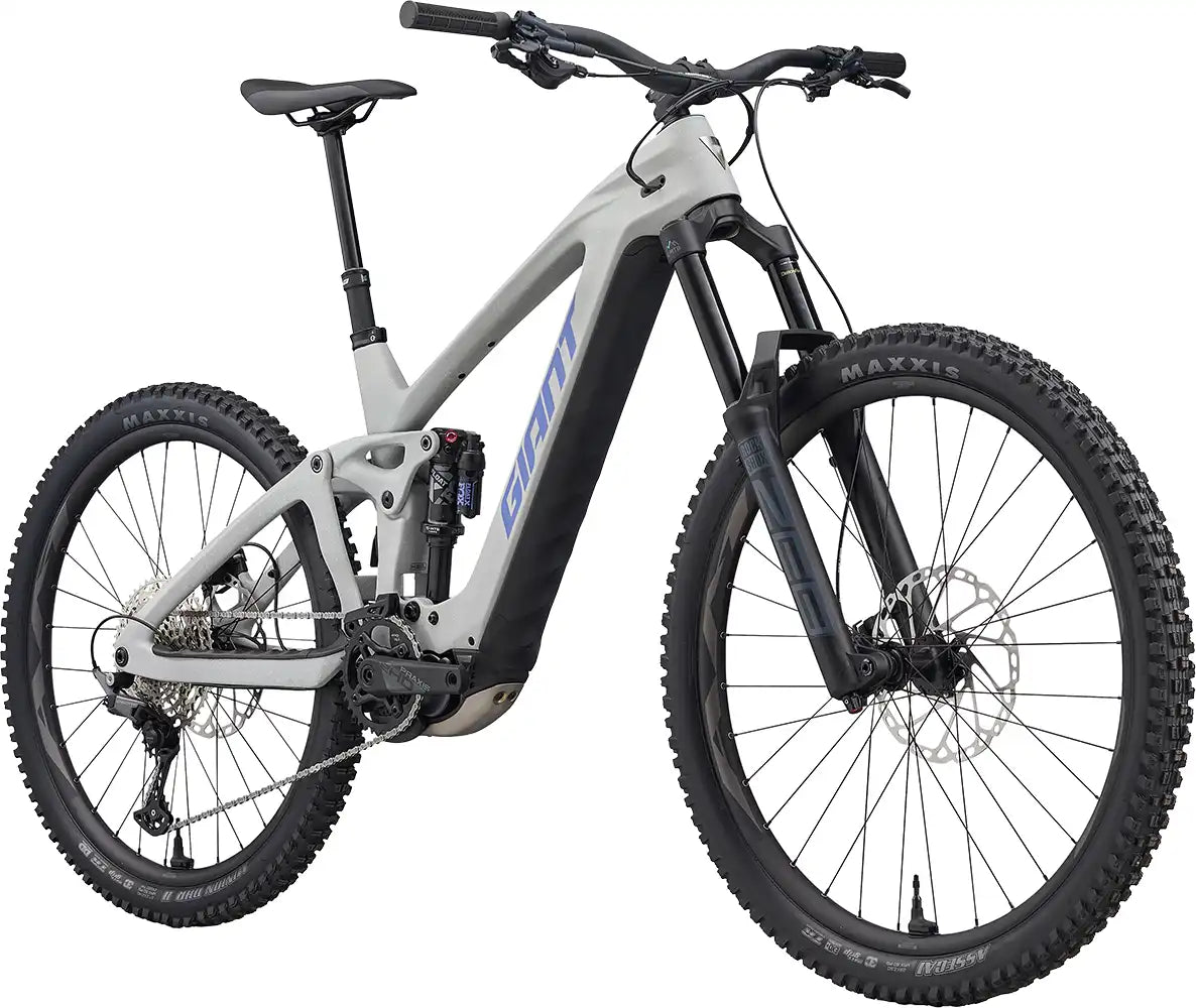 Giant Reign Advanced E+ 2 electric mountain bike in Moon Dust color, front view showing sturdy frame and suspension system.