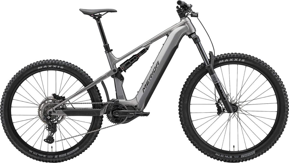Merida eOne Sixty 400 e-bike in gunmetal grey and black, showing the mountain bike frame and front suspension.