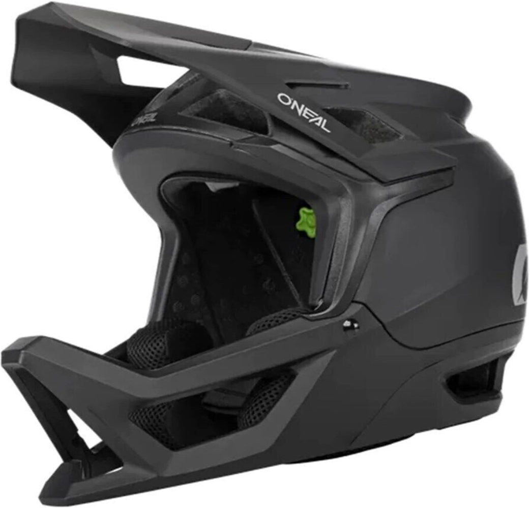 Full face helmet from Oneal's Transition series, featuring a sleek black design with ventilation and secure strap system.
