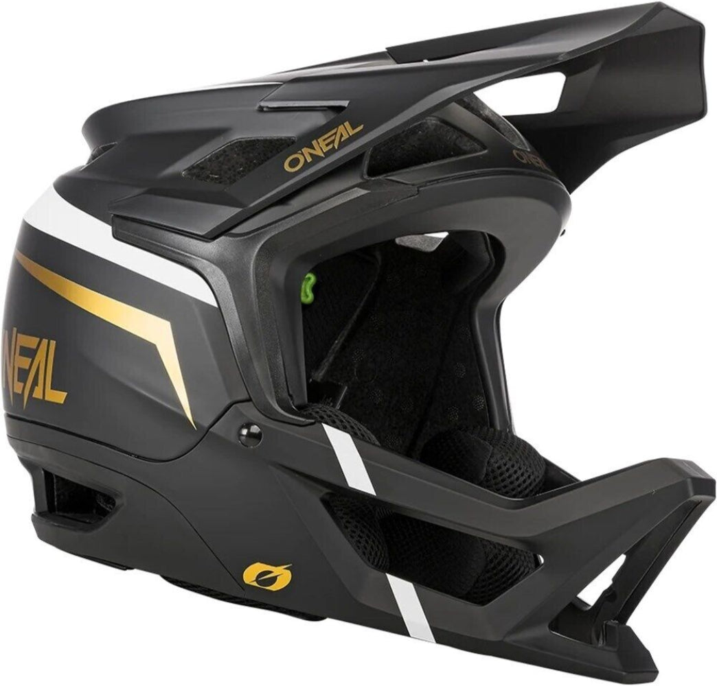 Oneal Transition full face helmet with black and white design, featuring ventilation vents and secure chin strap for motorcycle riding.