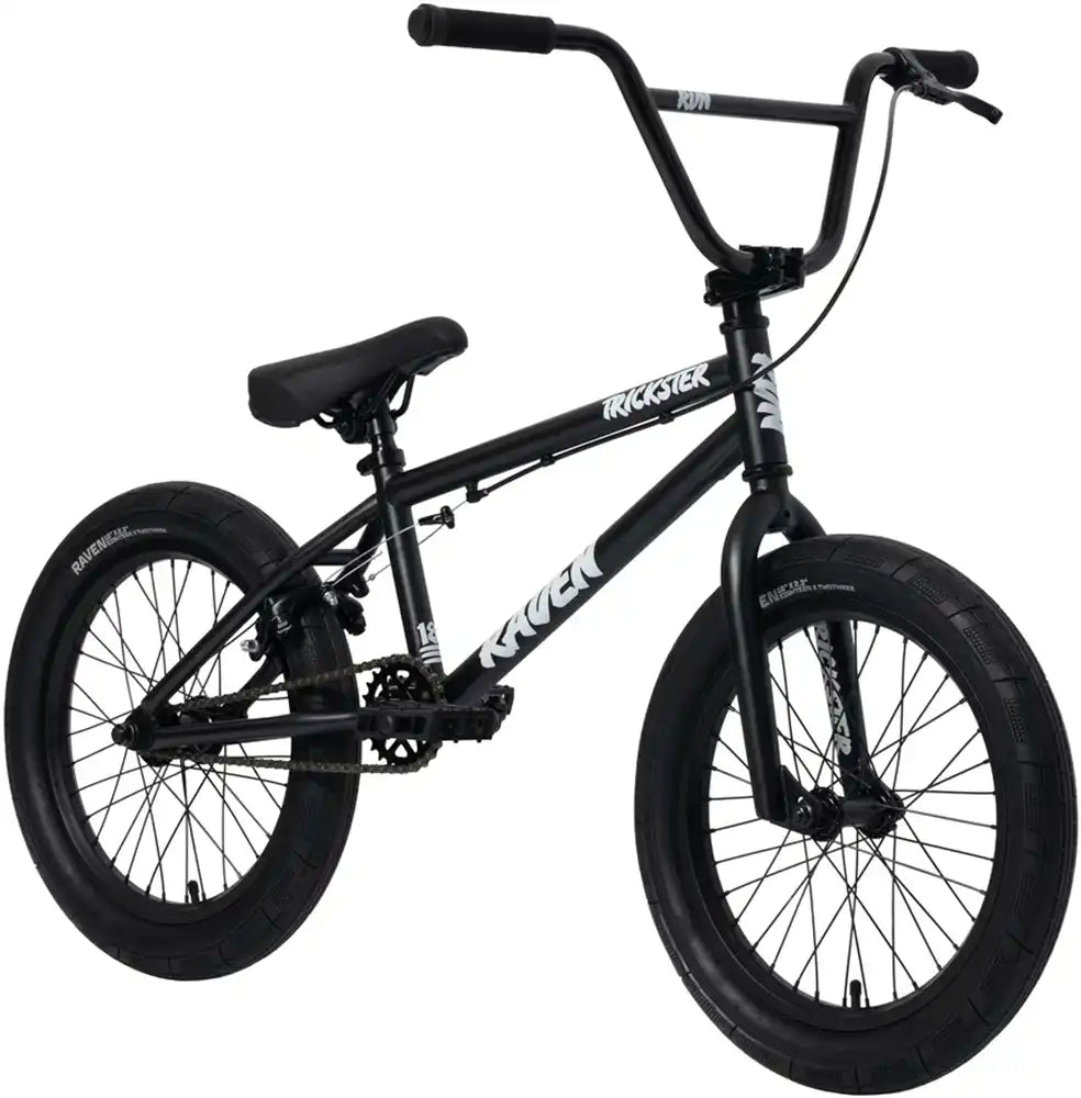 Raven Trickster 18 BMX bike with black frame and colorful decals, designed for young riders, featuring sturdy tires and a sleek style.
