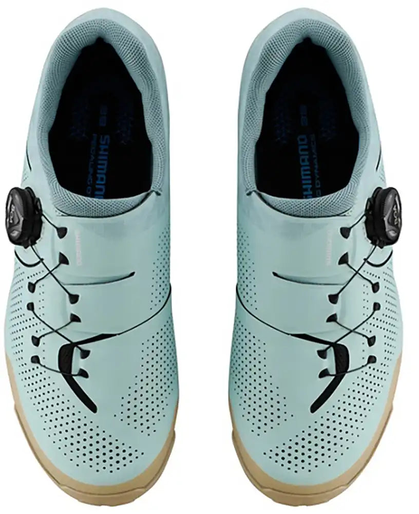 Shimano XC302 women's mountain biking shoes, black with Shimano branding, featuring rugged outsole and secure closure system.