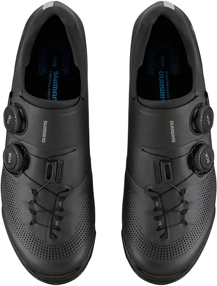 Shimano XC703 men's mountain bike shoes with black and gray design, featuring rugged soles and secure fastening system.