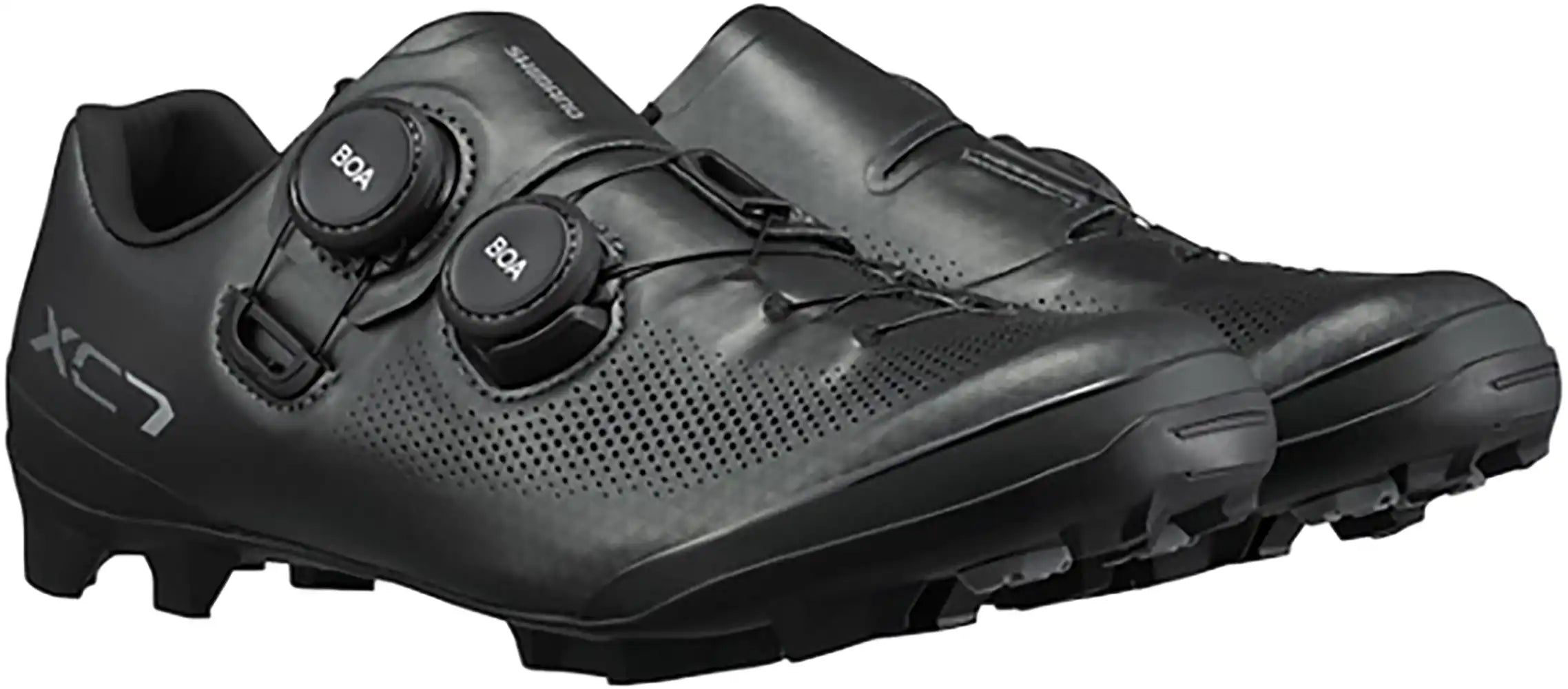 Shimano XC703 women's MTB shoes in black with white accents, featuring a durable sole and secure fastening system for mountain biking.