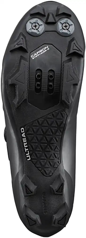 Shimano XC703 women's mountain biking shoes with black and gray design, featuring rugged soles and secure strap closures.
