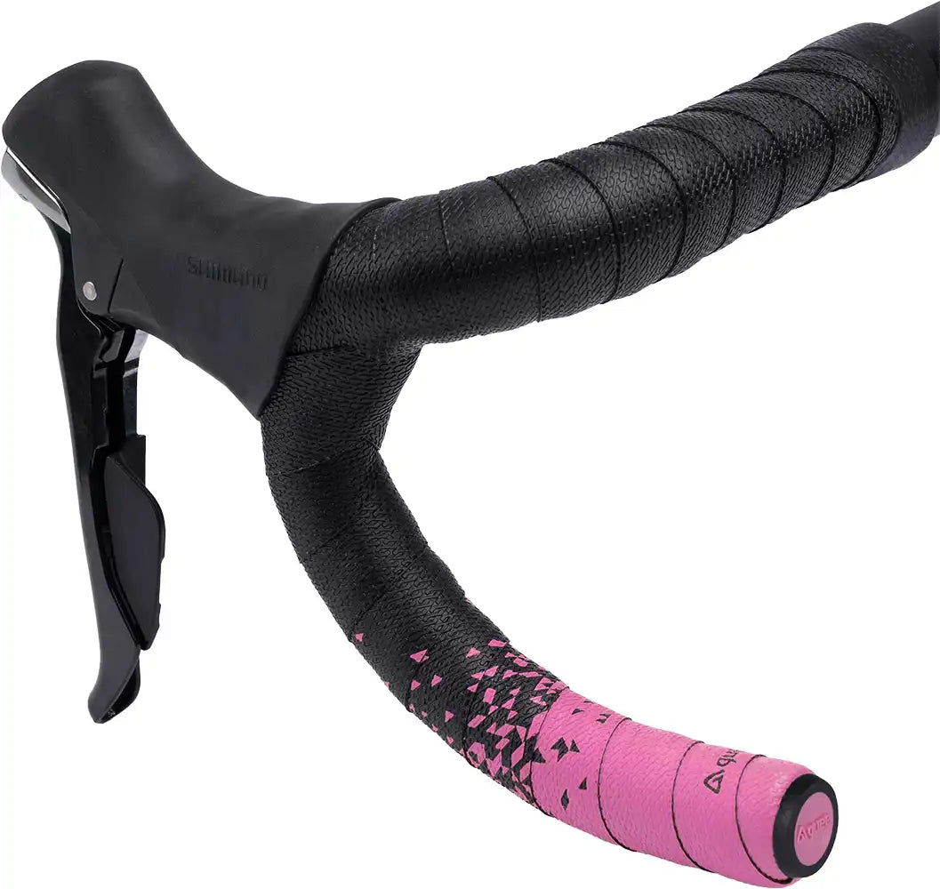 Pink Guee SL dual handlebar tape for bicycle handlebars, showcasing soft, textured material and vibrant color.