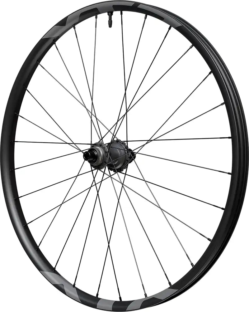 Shimano XTR Enduro M9220 carbon tubeless disc wheel showing black and silver rim with disc brake mount for mountain biking.