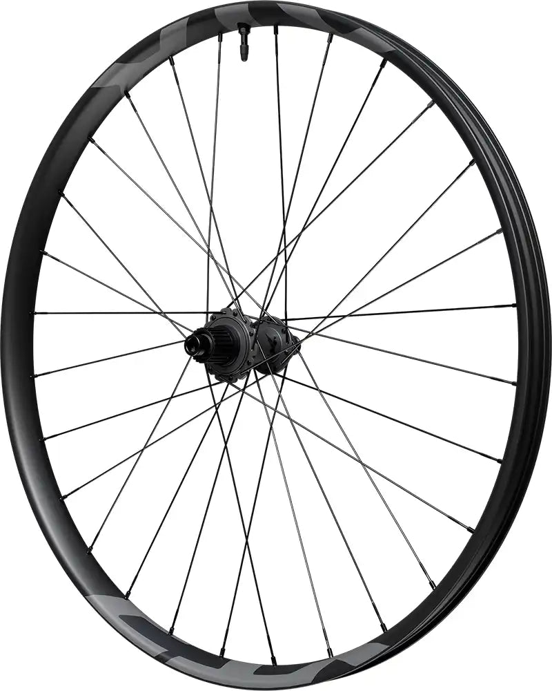 Shimano XTR Enduro M9220 carbon tubeless disc wheel with black rim and silver spokes, suitable for mountain biking.