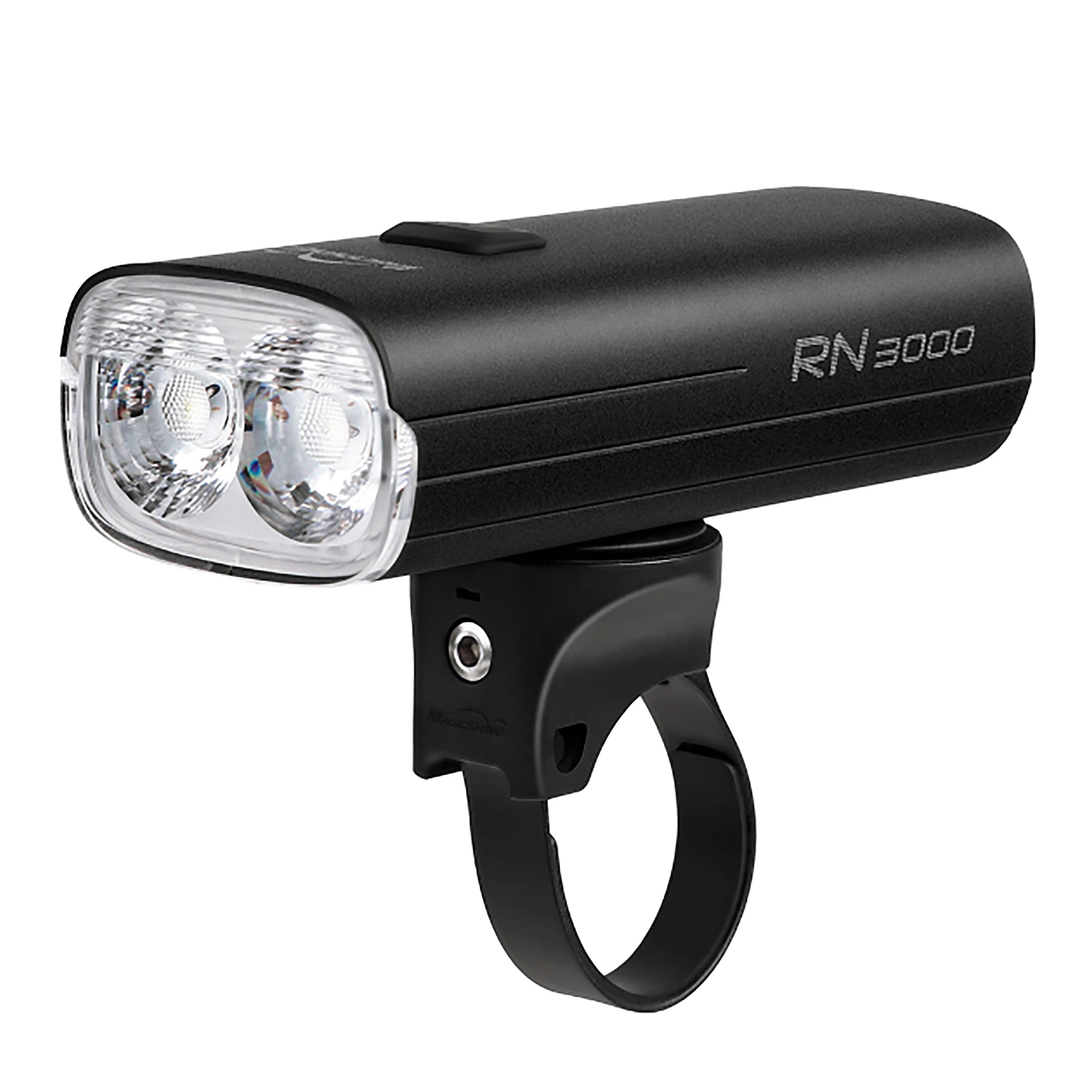 Magicshine RN 3000 USB front bike light mounted on a bicycle handlebar, showcasing its compact design and bright LED illumination.