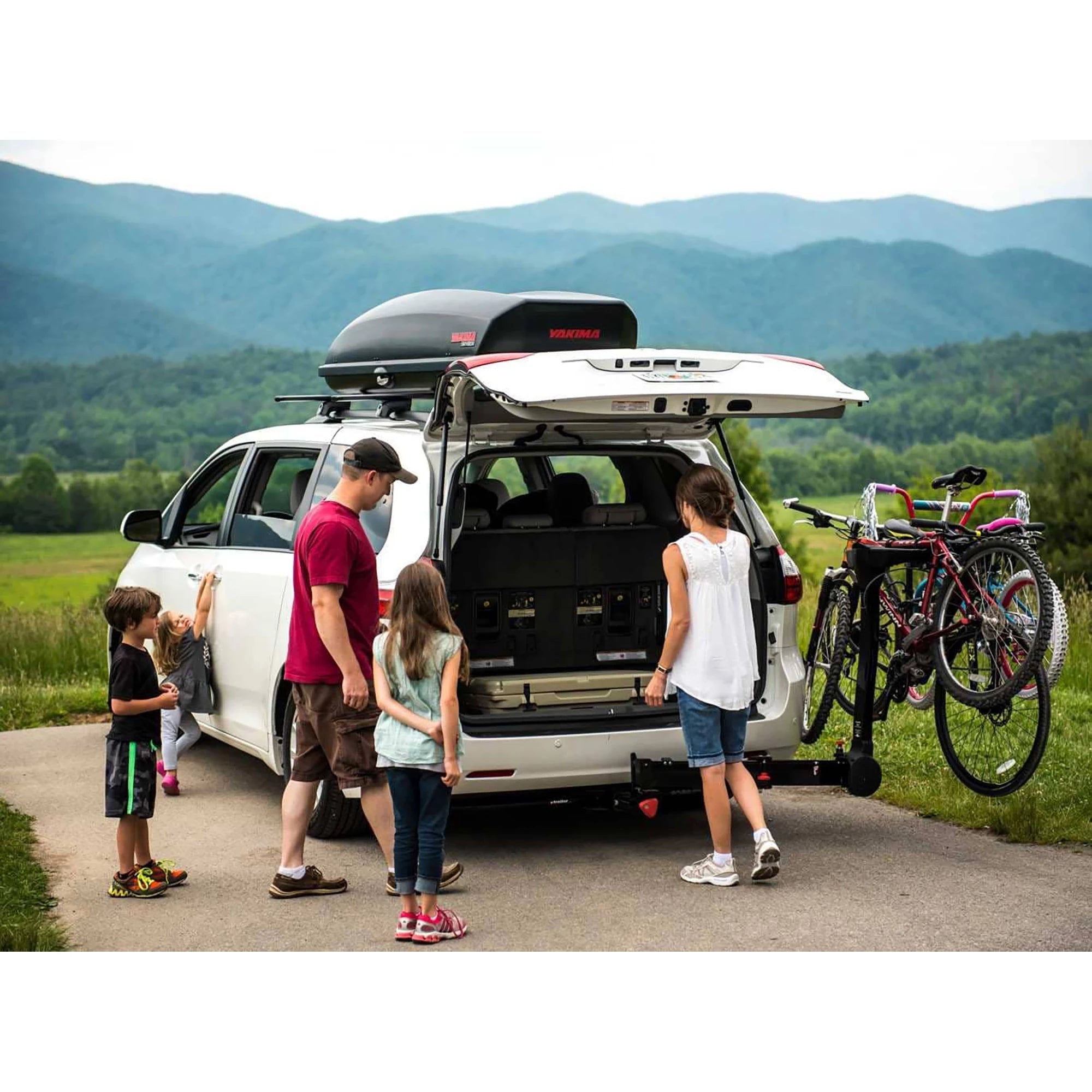 Yakima Fullswing 4 Bike Hitch Carrier mounted on vehicle, showing secure bike racks and hitch attachment for outdoor cycling trips.