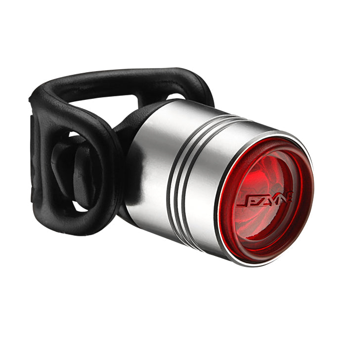 Lezyne Femto Drive 7 rear LED light with silver casing, compact bicycle accessory for enhanced visibility and safety.