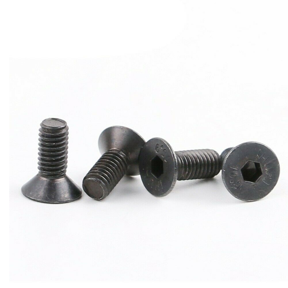 Shimano SPD cleat bolts, bike pedal parts, close-up of stainless steel bolts for securing SPD cleats.