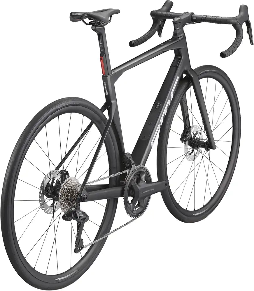 BMC Roadmachine ONE road bike with sleek frame and drop handlebars, ready for cycling on paved roads.