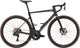 BMC Teammachine SLR 01 FOUR road bike with lightweight frame, aerodynamic design, and racing handlebars in sleek black and red colors.