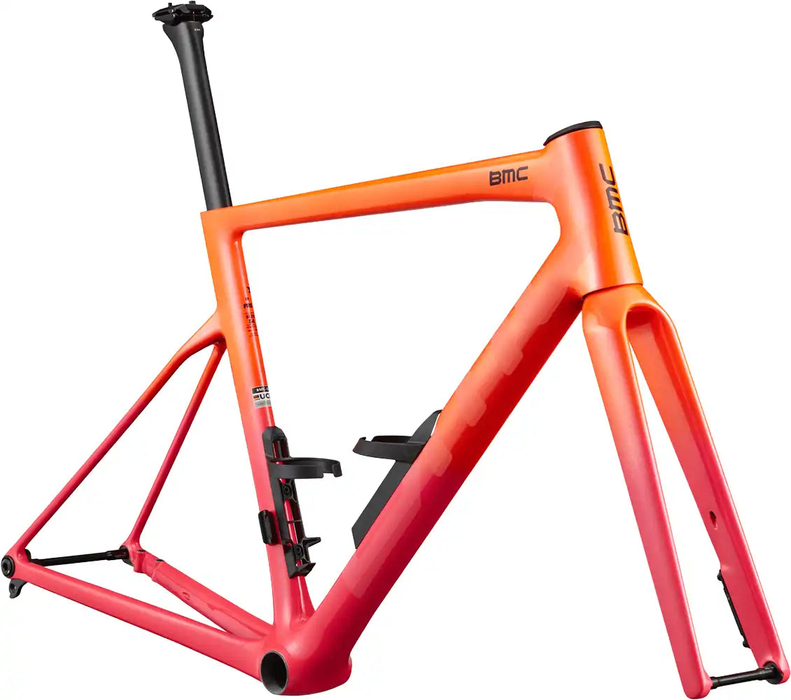 BMC Teammachine SLR 01 road bike frameset in sleek black and red, lightweight carbon construction with aerodynamic design.