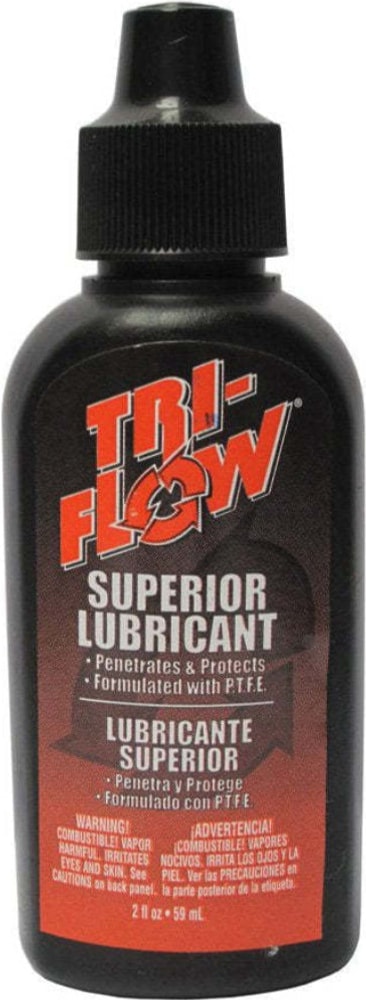 Tri-Flow Superior Lubricant accessory bottle with label, designed for bicycle chains and mechanical parts.