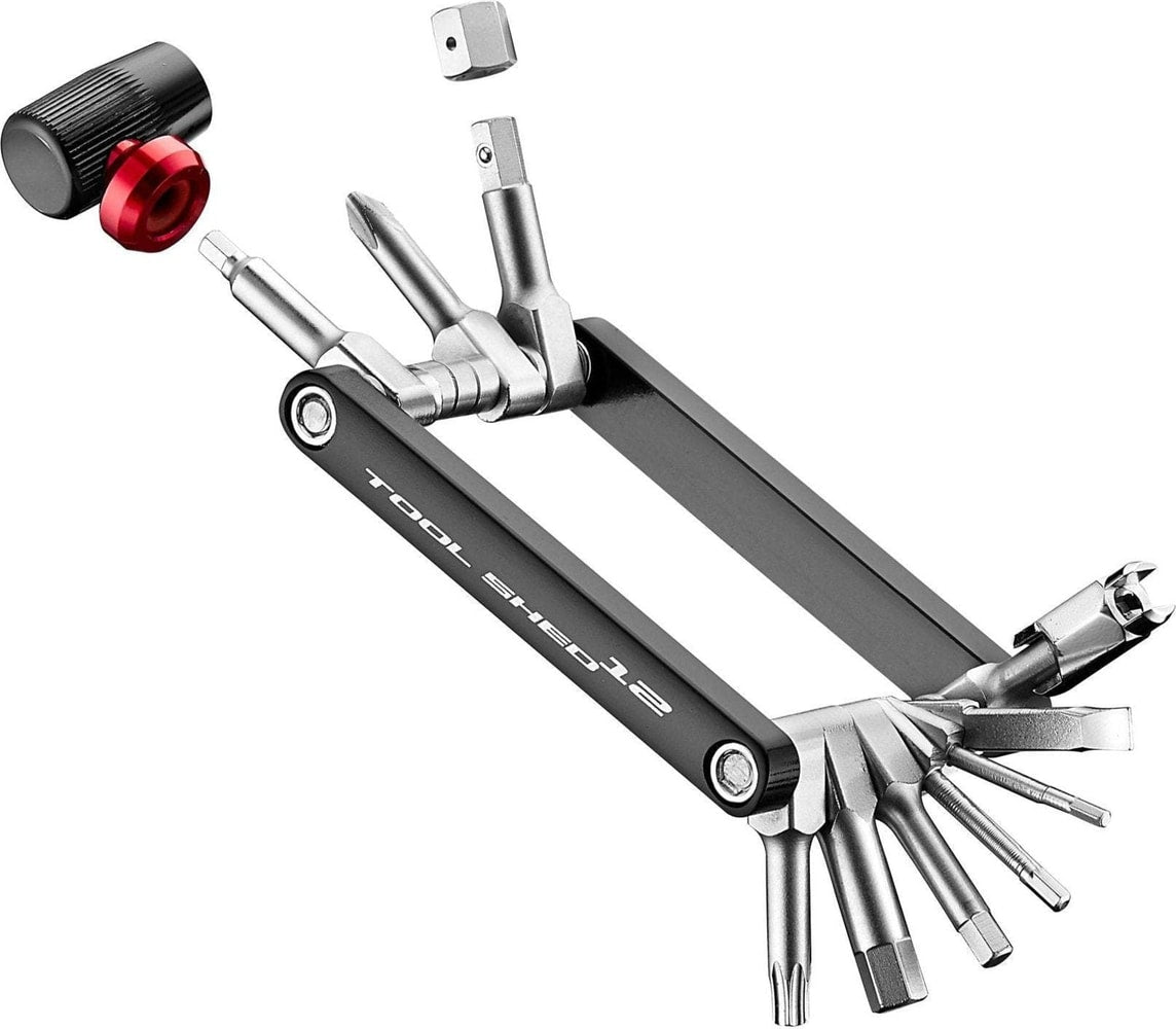 Giant Tool Shed 12 Multi Tool accessories with various attachments laid out on a workbench.
