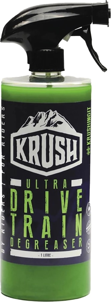 Krush Ultra Drivetrain Degreaser bottle, a bike cleaning accessory with a white label and spray nozzle for bike drivetrain maintenance.