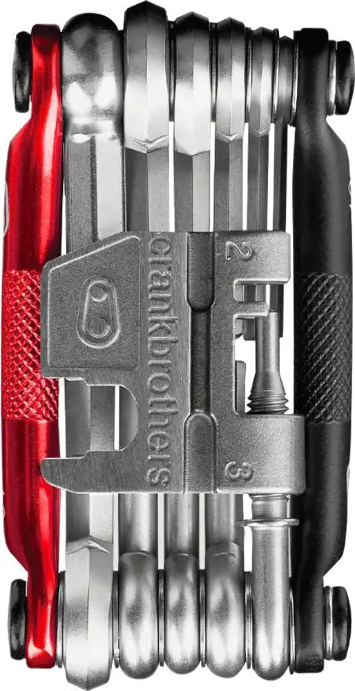 Crankbrothers M17 multi-tool with various Allen wrenches, screwdrivers, and a chain tool for bicycle repair and maintenance.