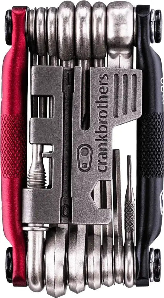 Crankbrothers M20 multi-tool with various Allen keys and screwdrivers, compact accessories for bike repairs and maintenance.