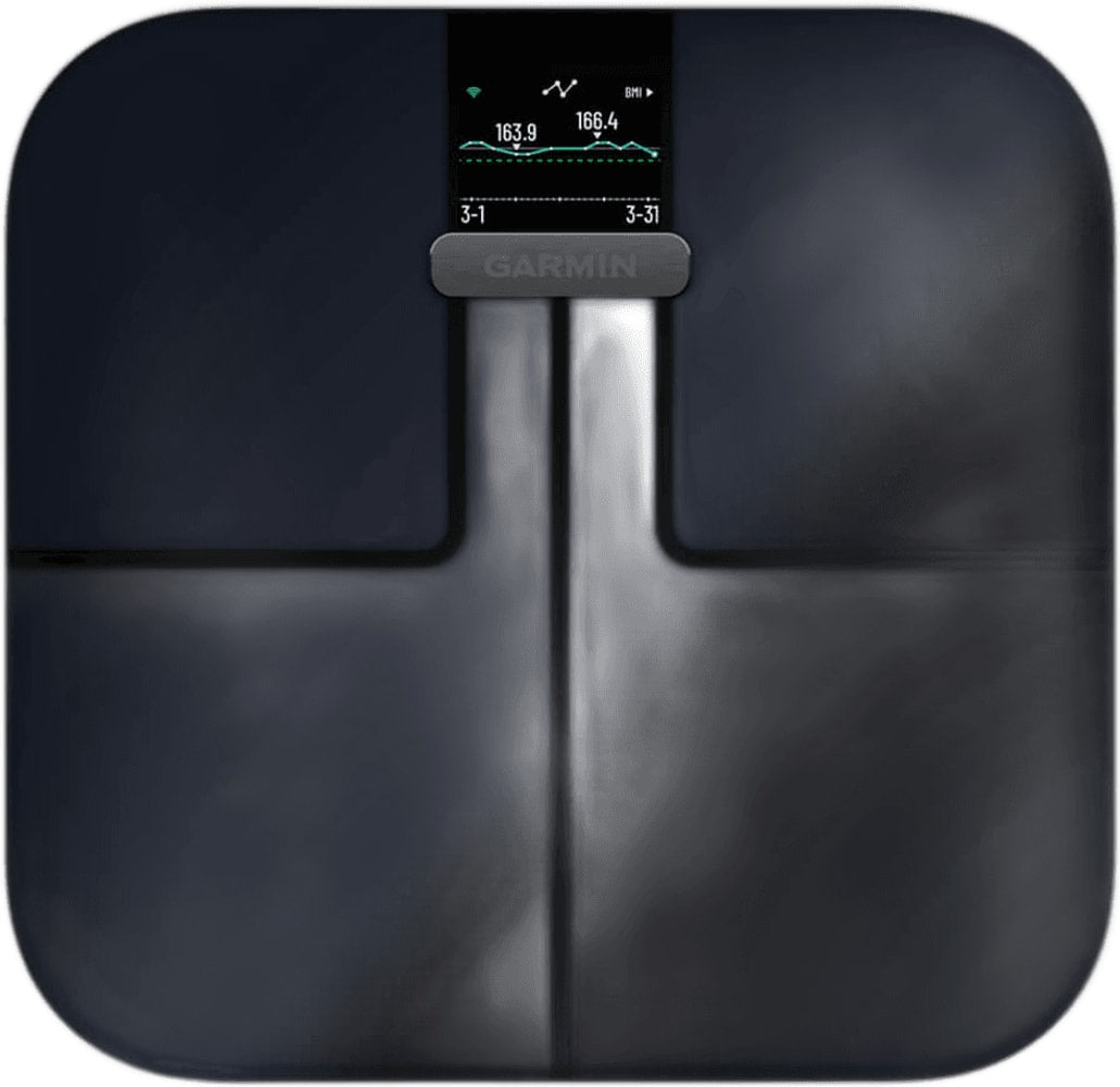 Garmin Index S2 smart scales displaying weight measurement on a digital screen, with sleek design and modern accessories.