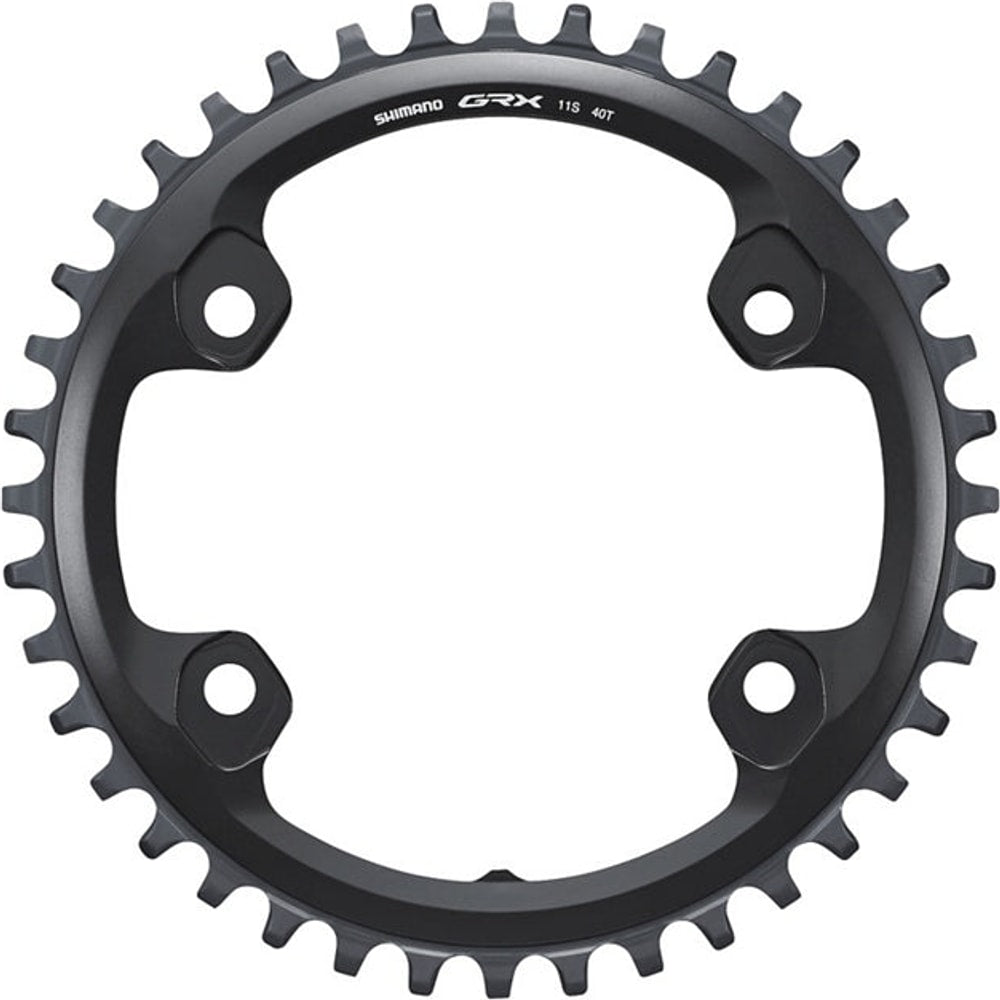 Shimano GRX RX810-1 11-speed chainring for bike parts, showing the gear teeth and branding on a black metal component.