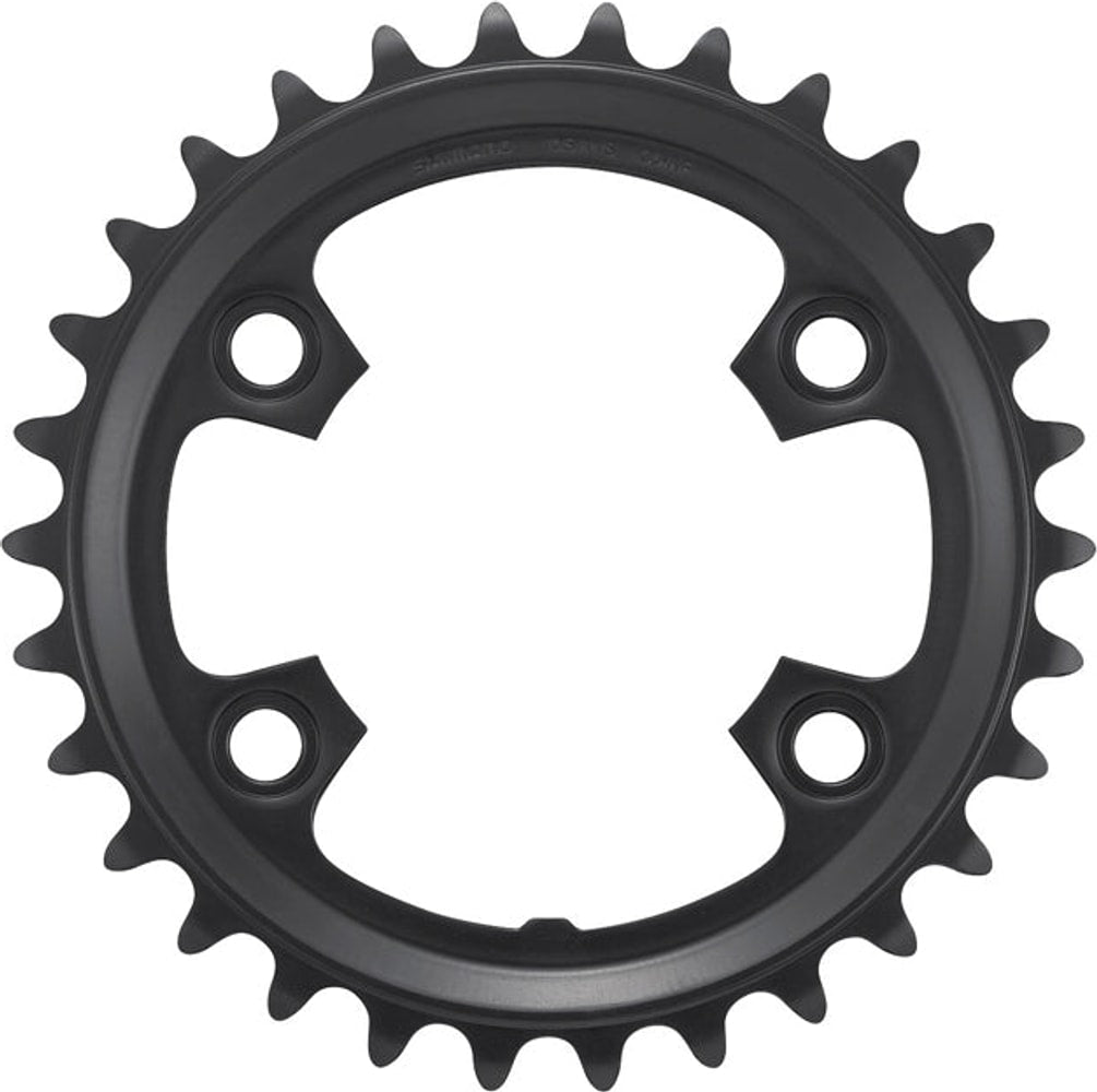 Shimano GRX RX600-2 11-speed bicycle chainring showing the black metal gear with bolt holes for mountain bike drivetrain.