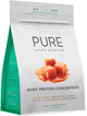 Pure Sports Nutrition Whey Protein Concentrate in 1kg caramel flavor, showing the protein powder container with caramel-colored powder.